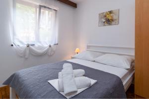 Postel nebo postele na pokoji v ubytování Apartments with parking spaces Crikvenica - 5494