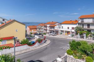 a view of a street in a town with houses at Apartments with a parking space Crikvenica - 5494 in Crikvenica