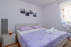 Postel nebo postele na pokoji v ubytování Apartments with parking spaces Crikvenica - 5494