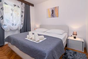 Postel nebo postele na pokoji v ubytování Apartments with parking spaces Crikvenica - 5494