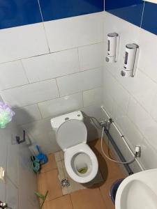 a small bathroom with a toilet and a sink at Modern Moroccan apartment near the beach in Safi in Safi