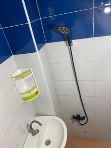 a bathroom with a shower and a toilet and a sink at Modern Moroccan apartment near the beach in Safi in Safi