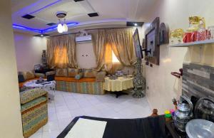 a living room with a couch and a table at Modern Moroccan apartment near the beach in Safi in Safi