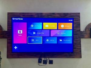 a flat screen tv hanging on a wall at Modern Moroccan apartment near the beach in Safi in Safi