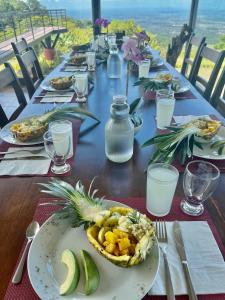 a long table with a plate of food on it at Hotel Finca 360 in Marsella