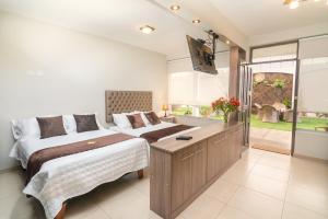 Ένα ή περισσότερα κρεβάτια σε δωμάτιο στο Apart-hotel Villakayro +127 φωτογραφίες
