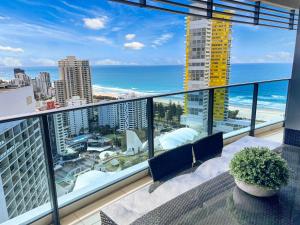 a balcony with a view of the beach and the ocean at Oracle 28th floor Tower 2 Ocean views! - GC Getaways in Gold Coast