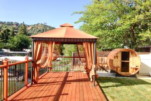 a gazebo on a deck in a yard at Clearlake Charmer in Clearlake Oaks