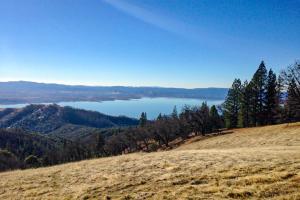 a view of a lake from the top of a hill at Clearlake Charmer in Clearlake Oaks
