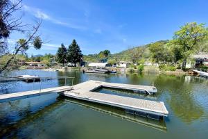 a dock in the middle of a body of water at Clearlake Charmer in Clearlake Oaks