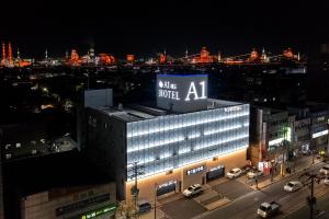 a large building with a large sign on it at night at Pohang A1Hotel Haedo in Pohang