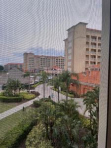 a view of a city with palm trees and buildings at Kay's Sweet Suite Near Disney in Orlando