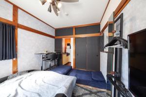 En eller flere senge i et værelse på Shiinamachi house