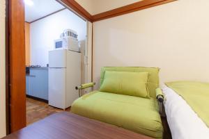 En eller flere senge i et værelse på Shiinamachi house + 20 billeder