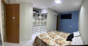 a small bedroom with a bed and a closet at Porto de Galinhas - Apartamento Flat Sea Residence 304 in Porto De Galinhas +26 photos
