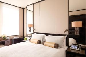 Letto o letti in una camera di The Peninsula Hong Kong