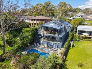 an aerial view of a large blue house with a pool at Vincentia Views in Vincentia