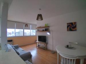 a living room with a couch and a table at Recoleta - Fantástico departamento in Buenos Aires