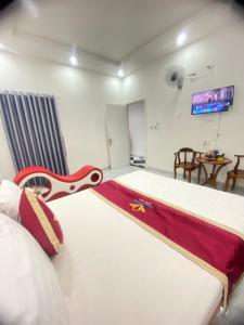 Postel nebo postele na pokoji v ubytování Happy 2 Hotel Bình Dương