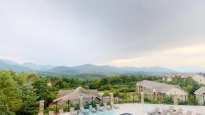 a view of a resort with a pool and mountains at Viewpoint Condominiums in Pigeon Forge