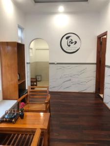 a waiting room with benches and a counter with aitating at Lightly Homestay in Ho Coc