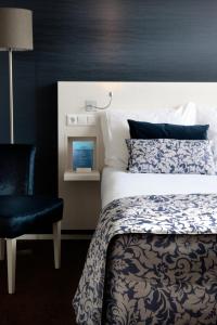 Postel nebo postele na pokoji v ubytování Hotel Zeerust Texel
