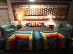 A bed or beds in a room at SPACE CASTLE: a 1950s Gas Station transformed into an Art Themed Wonderland