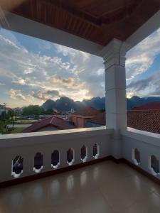 a view of the mountains from the balcony of a building at Inthavong Hotel/Guest House in Vang Vieng