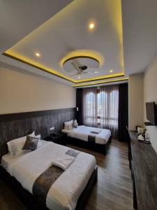 Postel nebo postele na pokoji v ubytování Hotel Yang Bhutan