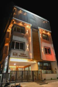 a building with lights on the side of it at KK SERVICE APARTMENTS in Vellore