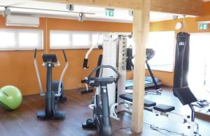 a gym with several exercise bikes in a room at Hotel Restaurant Prechtlhof in Althofen