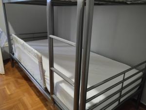 Postel nebo postele na pokoji v ubytování Άνετο στυλάτο σπίτι στο Μικρολίμανο του Πειραιά