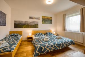 Postel nebo postele na pokoji v ubytování Apartmány Filipovice