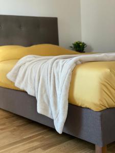 Postel nebo postele na pokoji v ubytování Kvartal Lux Apartment