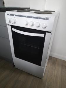 a white stove top oven in a kitchen at Home from Home in Faversham