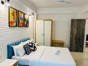 CasaFlip Homely Apartments in Anjunaにあるベッド