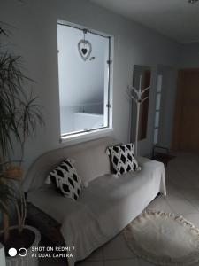 Posteľ alebo postele v izbe v ubytovaní Apartament przy Słonecznej