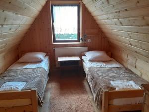 Łóżko lub łóżka w pokoju w obiekcie Dom Wypoczynkowy Grań