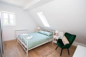Postel nebo postele na pokoji v ubytování Apartmani Kac