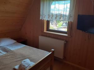Łóżko lub łóżka w pokoju w obiekcie Dom Wypoczynkowy Grań