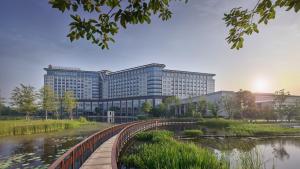 a rendering of a building next to a river at InterContinental Nantong, an IHG Hotel-Best view of yangtze in Nantong