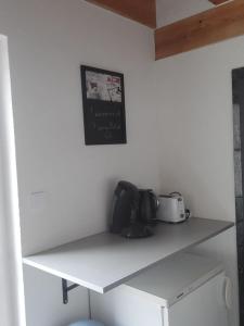 a white shelf in a kitchen with a toaster on it at L'oasis de Dalhunden - Logement privé dans villa avec Piscine in Dalhunden