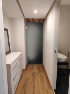 a bathroom with a sink and a mirror at The City Walk in Naples