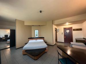 Posteľ alebo postele v izbe v ubytovaní Hotel Griselda
