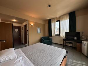 Posteľ alebo postele v izbe v ubytovaní Hotel Griselda