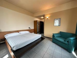 Posteľ alebo postele v izbe v ubytovaní Hotel Griselda