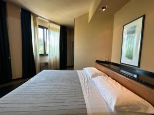 Posteľ alebo postele v izbe v ubytovaní Hotel Griselda