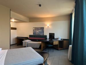 Posteľ alebo postele v izbe v ubytovaní Hotel Griselda