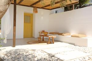 a patio with a table and a chair in a house at Syrolia village in Kinion