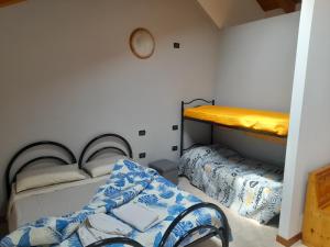 Postel nebo postele na pokoji v ubytování Agriturismo Val di Ferro